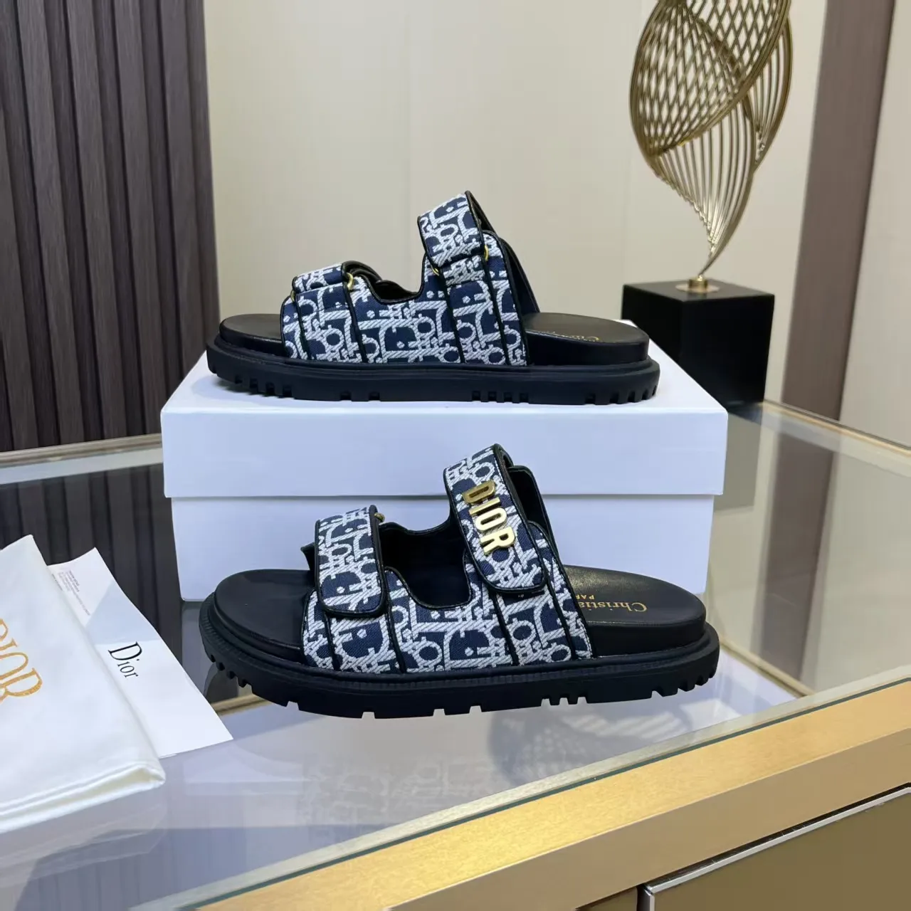 👟👟Ex-factory price 480👟👟 Dior classic popular sandals Step into the fashion territory of Dior slippers and encounter the ultimate fusion of elegance and comfort. The upper is engraved with the Christian Dior Paris logo using exquisite embroidery technology. The delicate stitching tells the brand's profound heritage and is fully recognizable.   Made of high-quality materials, it feels soft and fits your feet, as if it is a gentle care tailor-made for your feet. The sole is carefully designed and engraved with Christian Dior's lucky star symbol. It is not only a beautiful embellishment, but also provides reliable grip, making every step steady and secure.   It has a simple design and is easy to put on and take off. Whether it is a lazy weekend or a pleasant vacation, it can be easily adapted. Whether paired with casual shorts, casual jeans, or an elegant dress, Dior slippers can instantly enhance the overall style and show a casual fashion attitude.   Dior slippers, in the name of fashion, inject luxurious charm into your life and accompany you with every step you take with confidence and elegance. Material: Fine genuine cowhide upper, outsole, TPR, non-slip and wear-resistant, code number: 35-41 (42 customized)
